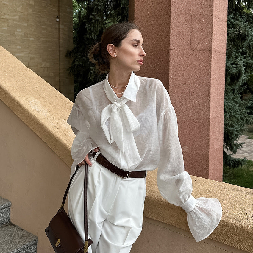 XAKXX Autumn and winter Russian high-end temperament bow tie sexy see-through crepe horn sleeve casual women's shirt
