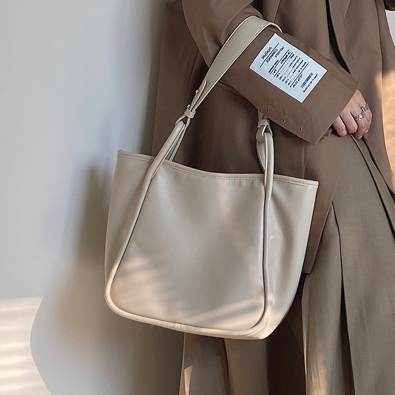 XAKXX 2025 Lazy wind premium women's bag Korean version ins simple commuter bag solid color soft surface portable shoulder bag large bag