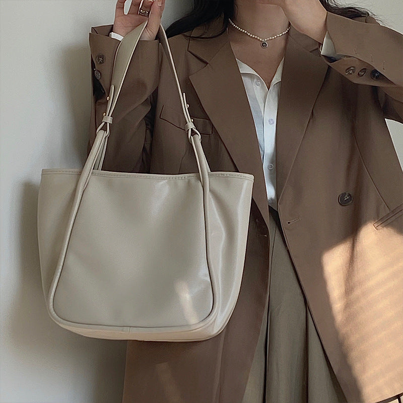 XAKXX 2025 Lazy wind premium women's bag Korean version ins simple commuter bag solid color soft surface portable shoulder bag large bag