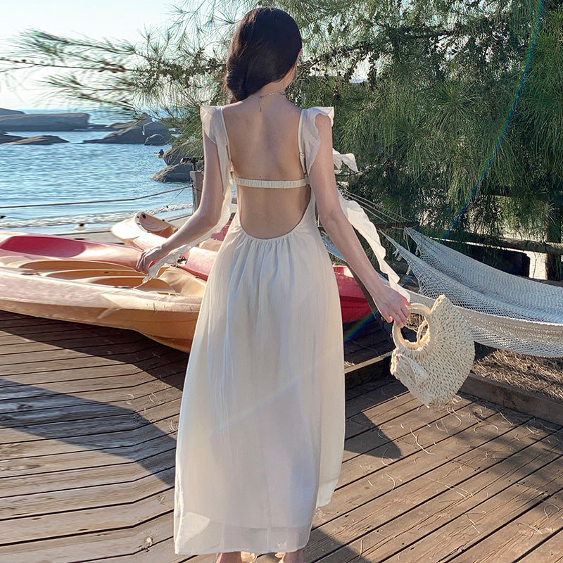 2025 small fly sleeve ruffle edge strap backless suspender dress female summer vacation wind fairy big swing a-word skirt