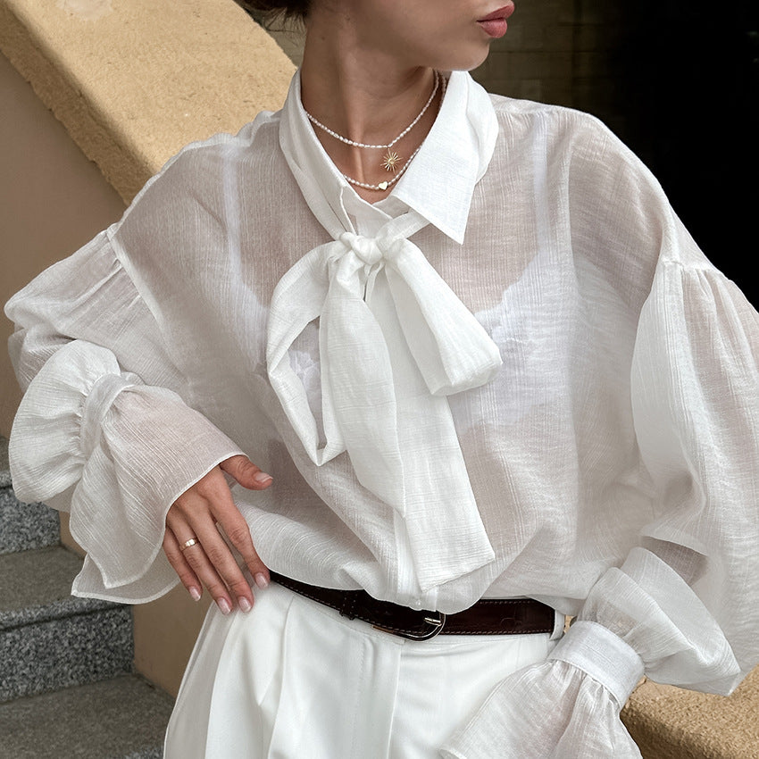 XAKXX Autumn and winter Russian high-end temperament bow tie sexy see-through crepe horn sleeve casual women's shirt