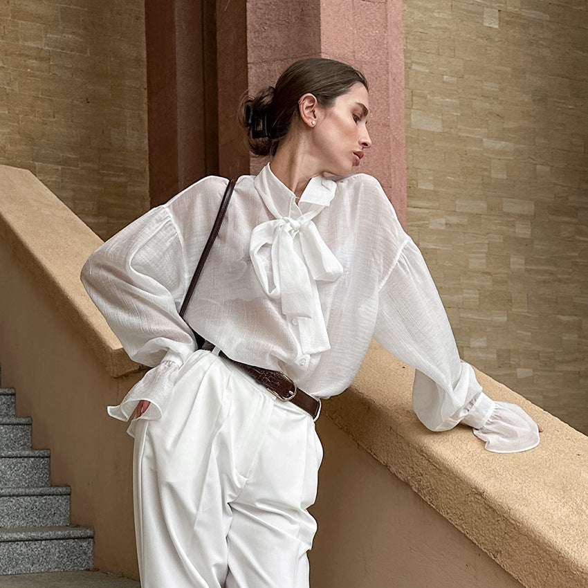 XAKXX Autumn and winter Russian high-end temperament bow tie sexy see-through crepe horn sleeve casual women's shirt