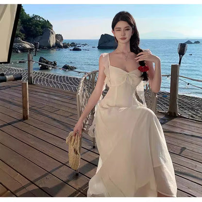 2025 small fly sleeve ruffle edge strap backless suspender dress female summer vacation wind fairy big swing a-word skirt