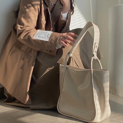 XAKXX 2025 Lazy wind premium women's bag Korean version ins simple commuter bag solid color soft surface portable shoulder bag large bag