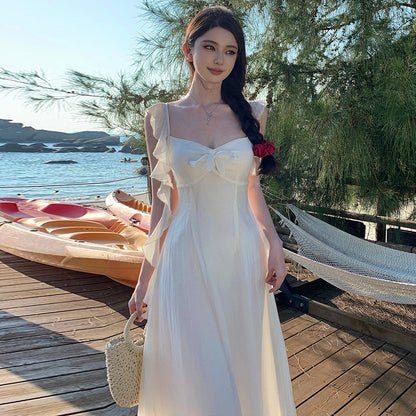2025 small fly sleeve ruffle edge strap backless suspender dress female summer vacation wind fairy big swing a-word skirt