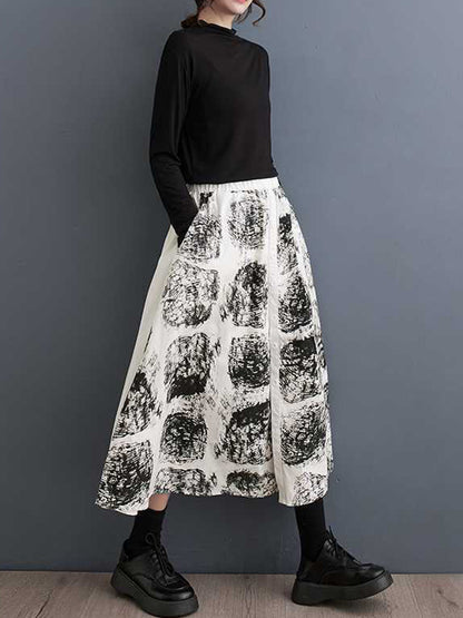 xakxx A-Line Loose Contrast Color Elasticity Printed Split-Joint Skirts